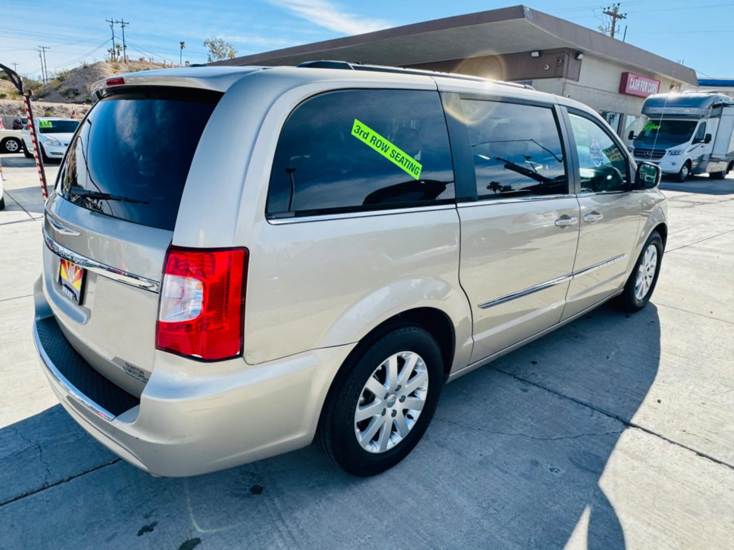 2015 gold Chrysler Town & Country (2C4RC1BG8FR) , located at 2190 Hwy 95, Bullhead City, AZ, 86442, (928) 704-0060, 0.000000, 0.000000 - 2015 Chrysler town and country . Loaded . Seats7 . Bluetooth , backup camera . Free warranty , we finance . drop down tv with dvd player. headphone sets. Michelin tires. v6 automatic . Top of the line van. Fully loaded. - Photo#3